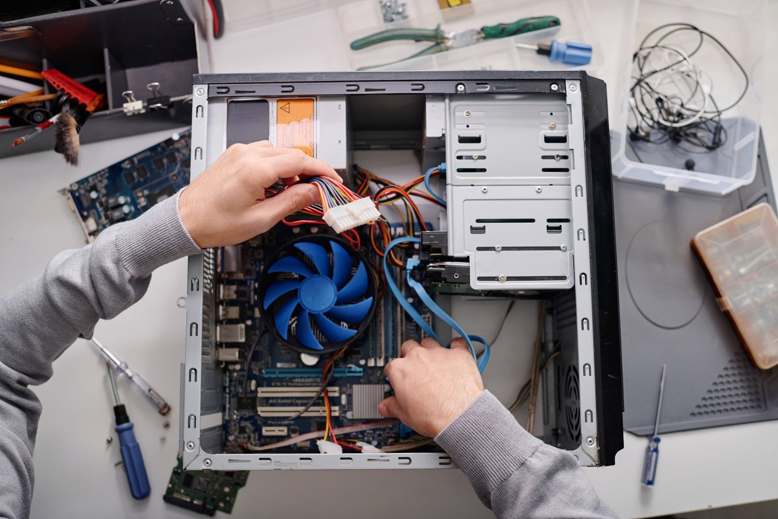 unrecognizable technician repairing system unit of computer